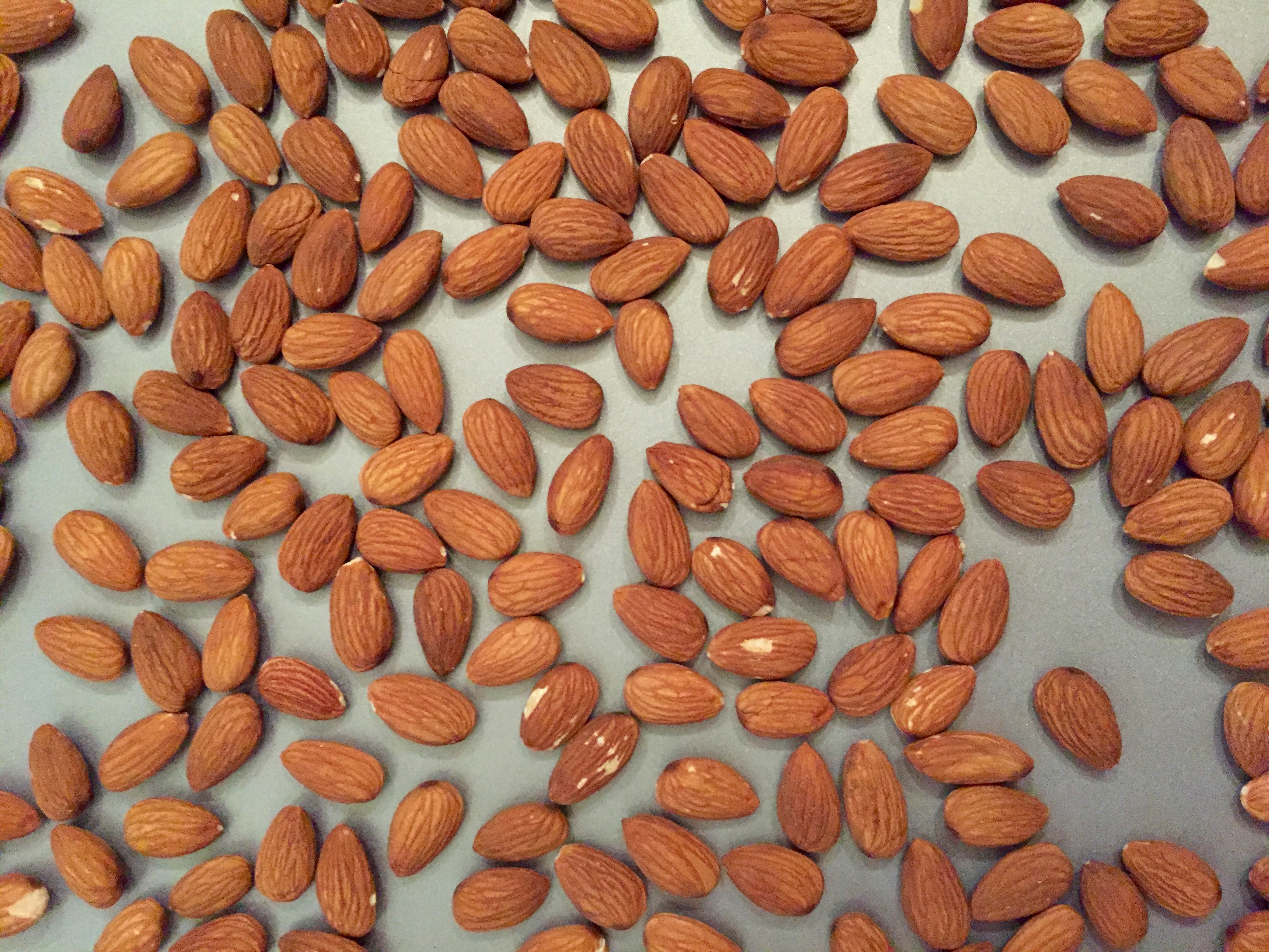 Almonds on a baking sheet.